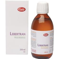 Eine braune Flasche Lebertran-Öl steht neben einer weißen Verpackung.